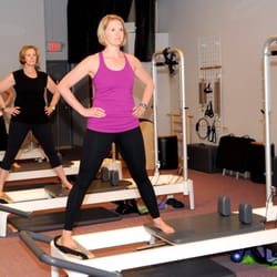Coreworks Fitness - Pilates reformer classes use spring resistance to give challenge for some exercises and support for others.