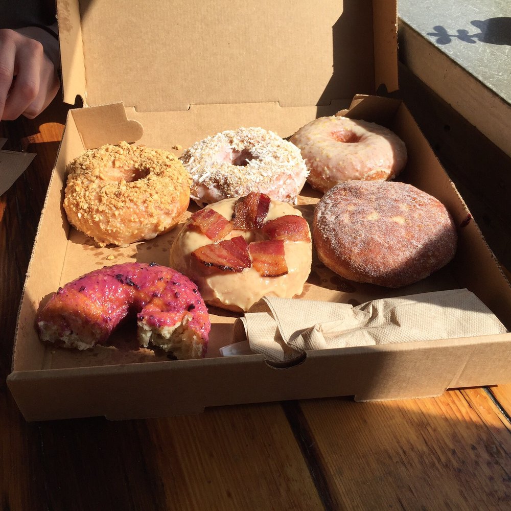 Union Square Donuts - Blueberry jam, Maple bacon, creamsicle, blueberry ginger, toasted coconut & brown butter hazelnut. - Donuts Near Me - Boston, Massachusetts Union Square Donuts - Blueberry jam, Maple bacon, creamsicle, blueberry ginger, toasted coconut & brown butter hazelnut. - Donuts Near Me - Boston, Massachusetts