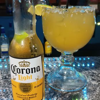 La Cabana - a bottle of corona light next to a glass of corona light - Mexican Near Me - Cave Spring, Georgia La Cabana - a bottle of corona light next to a glass of corona light - Mexican Near Me - Cave Spring, Georgia