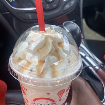 Scooter's Coffee - a hand holding a cup of ice cream - Coffee & Tea Near Me - Springfield, Missouri Scooter's Coffee - a hand holding a cup of ice cream - Coffee & Tea Near Me - Springfield, Missouri