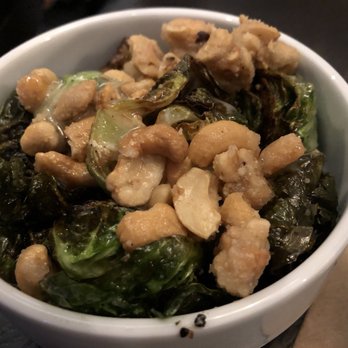 Society 1854 - Brussels sprouts roasted with candied nuts and tossed in a delicious creamy inspired dressing. - New American Near Me - Omaha, Nebraska