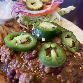 2 Creeks Bar & Grill - Fresh jalapeños on top of the chili cheeseburger make sure to order the cheeseburger with cheddar cheese - Bars Near Me - St. Augustine, Florida
