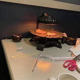 a table with a cake and a cup of coffee