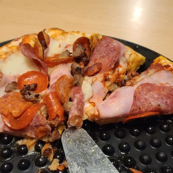 Mountain Mike's Pizza - a half eaten pizza - Pizza Near Me - San Diego, California