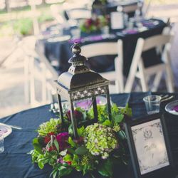 Miller Flowers - Lantern and floral center table peices.