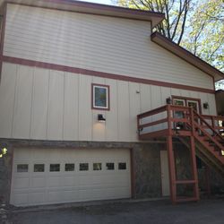 Pisgah Roofing and Restoration - New Hardie Board siding, windows and deck
