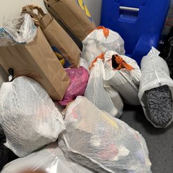 The Apartments at Dorsey Mill - The trash room filled with trash on the floor.