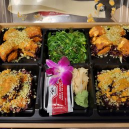 Mixed roll special -- spicy tuna and double spicy tuna with black rice and seaweed salad Mixed roll special -- spicy tuna and double spicy tuna with black rice and seaweed salad