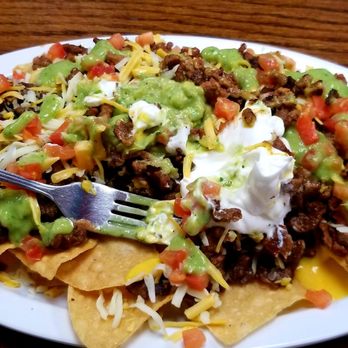 El Pilon - Carne Asada Nachos minus one forkful. - Mexican Near Me - West Covina, California El Pilon - Carne Asada Nachos minus one forkful. - Mexican Near Me - West Covina, California