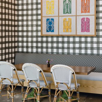 Flower Child - a table and chairs in a restaurant - Salad Near Me - Fort Worth, Texas Flower Child - a table and chairs in a restaurant - Salad Near Me - Fort Worth, Texas