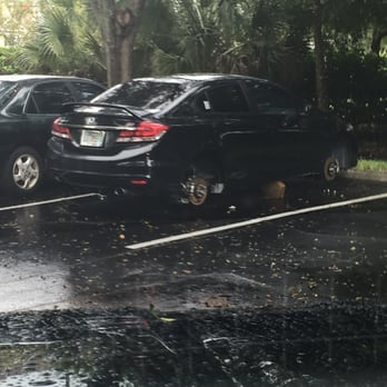 Arbors at Lee Vista - Twice outside our building cars were found on blocks like this. After multiple requests to repair and replace the lighting in the complex. - Apartments Near Me - Orlando, Florida