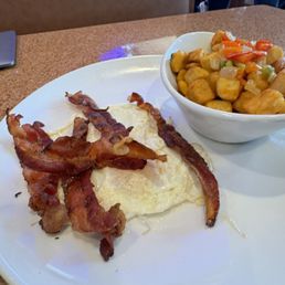 2 eggs, homefriend and bacon