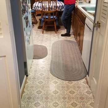 Empire Construction - a woman standing in a kitchen - General Contractors Near Me - Falls Church, Virginia