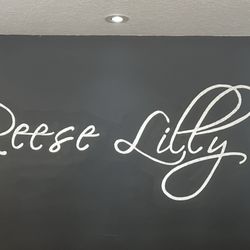 Signage above the check-in desk. Everything is beautiful and yet comfortable at this salon!!