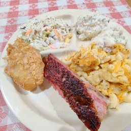 Rib, fried chicken, mac and cheese, potato salad and cole slaw Rib, fried chicken, mac and cheese, potato salad and cole slaw