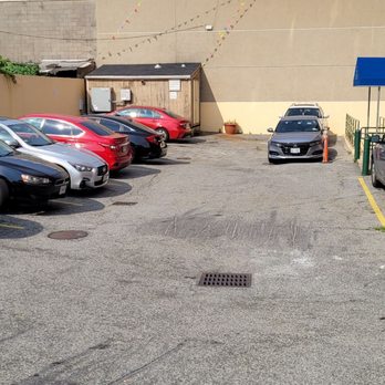 Blue Bird Inn - This is the parking lot! 12 tight spaces. - Hotels Near Me - Jamaica, New York