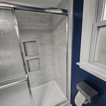 Calderon Remodeling & Landscaping - Here he took out my old tub and added a new standing shower and tile adding space for the shampoo - General Contractors Near Me - Chicago Heights, Illinois