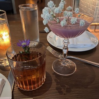 Lure Fishbar - Our cocktails: Wuthering Heights (left) and Lilac Mist (right) - Bars Near Me - Chicago, Illinois Lure Fishbar - Our cocktails: Wuthering Heights (left) and Lilac Mist (right) - Bars Near Me - Chicago, Illinois