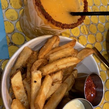 Social - Mango Margarita and house fries - New American Near Me - Costa Mesa, California Social - Mango Margarita and house fries - New American Near Me - Costa Mesa, California