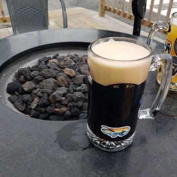 Marsh Island Brewing - a glass of beer on a table - Breweries Near Me - Orono, Maine
