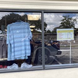 Women’s Center Upscale Resale Store - Store hours and a display