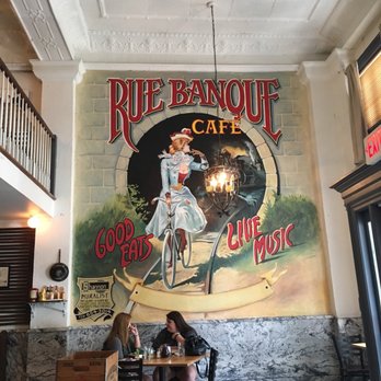 Bank Street Cafe - a mural of a woman on a bicycle - Cafes Near Me - Griffin, Georgia