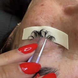 Lash & Brow Spa - 2 weeks after, going elsewhere to have this mess cleaned up! Clumps of fans