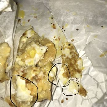 Holbrook Bagel Bakery - a piece of pizza left on the table - Bagels Near Me - Holbrook, New York