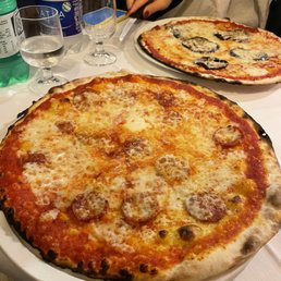 Pizza alla diavola (front) and pizza parmigiana (back) Pizza alla diavola (front) and pizza parmigiana (back)