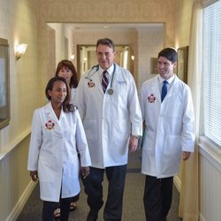 John Fullerton, MD - Hampton Health - Dr. Fullerton and his medical team doing rounds.