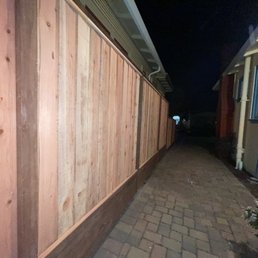 Long driveway new fence 8 ft tall to 3 ft towards the front Long driveway new fence 8 ft tall to 3 ft towards the front