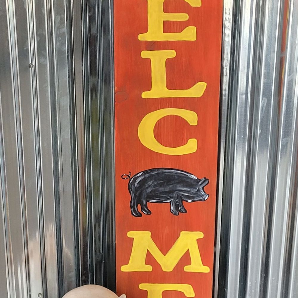 a pig and a sign that says who me a pig and a sign that says who me