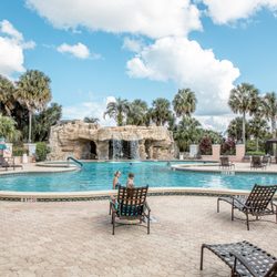 Orange Blossom Hills Golf & Country Club Restaurant - Pool area with waterfall. Service is available outside.