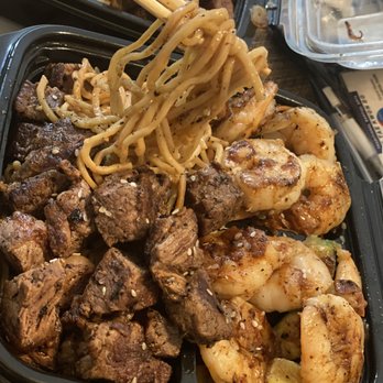 Bomb Bachi - a close up of a plate of food with chopsticks - Food Trucks Near Me Bomb Bachi - a close up of a plate of food with chopsticks - Food Trucks Near Me