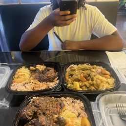 We got the jerk, chicken, oxtail, and goat curry We got the jerk, chicken, oxtail, and goat curry