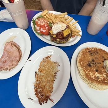 Bob & Edith's Diner - Strawberry milkshake, side of hash browns, hot cakes with ham and the iconic b&e burger - American Near Me - Arlington, Virginia
