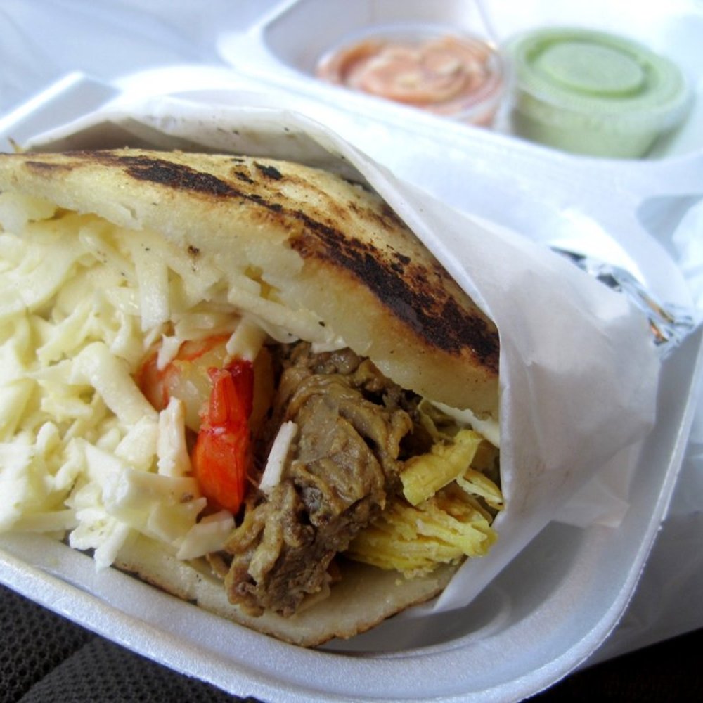 The Pelao - Arepa Con Todo. Shrimp, marinated steak, chicken, cheese. - Latin American Near Me - Orlando, Florida The Pelao - Arepa Con Todo. Shrimp, marinated steak, chicken, cheese. - Latin American Near Me - Orlando, Florida