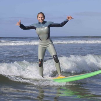 Wavehuggers - Nothing beats the feeling of standing up for your first time! - Surf Schools Near Me - Huntington Beach, California