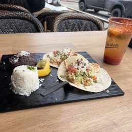 Mahi mahi tacos with rice and beans