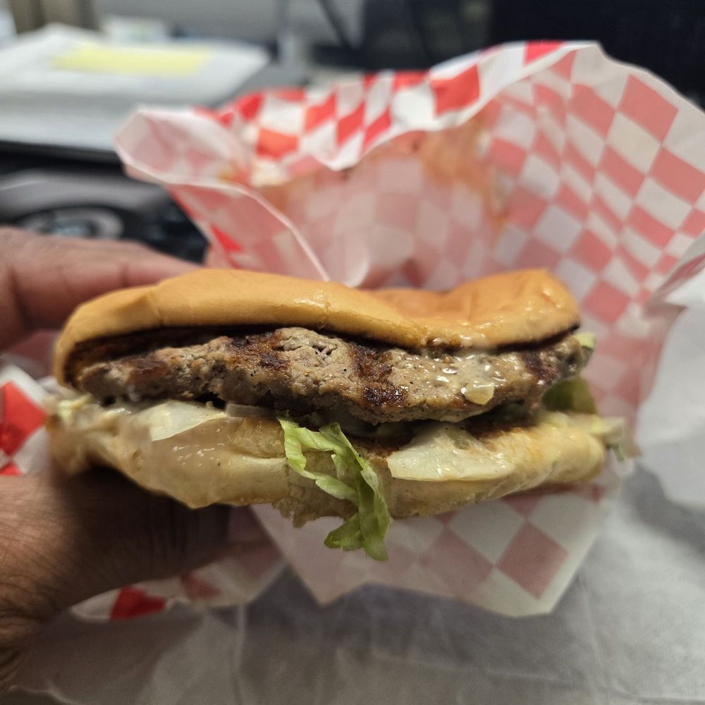 A flattened DELUXE burger combo