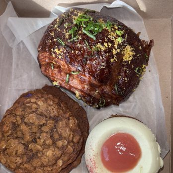 Del Sur Bakery & Cafe - Ube Oatmeal Cream Pie bottom left, pandan basque cake on bottom right, & longanisa croissant at the top - Filipino Near Me - Chicago, Illinois Del Sur Bakery & Cafe - Ube Oatmeal Cream Pie bottom left, pandan basque cake on bottom right, & longanisa croissant at the top - Filipino Near Me - Chicago, Illinois