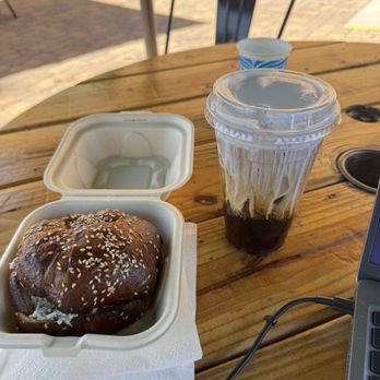 Exit Zero Coffee - Chicken salad sandwich on pretzel croissant, cold brew with honey lavender cold foam - Coffee & Tea Near Me - Las Vegas, Nevada