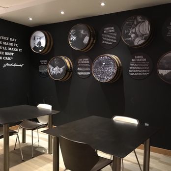 Jack Daniels Lounge - tables and chairs in a black room - Lounges Near Me - Las Vegas, Nevada