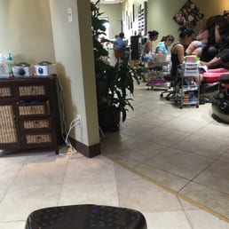 Sitting at the back of the salon. 7 pedi chairs.
