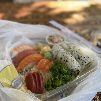 Thai Palace & Sushi Bar - a plastic container with sushi and vegetables - Thai Near Me - Conyers, Georgia