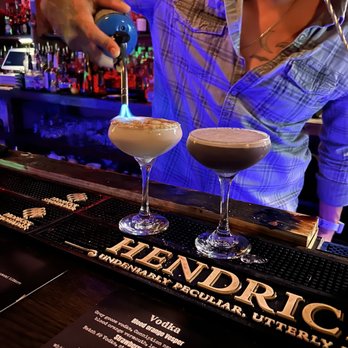 Whiskey Tango Foxtrot - a bartender pouring a drink - Cocktail Bars Near Me - Wilmington, North Carolina Whiskey Tango Foxtrot - a bartender pouring a drink - Cocktail Bars Near Me - Wilmington, North Carolina