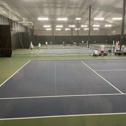 The Sports Mall - Courts filled with tennis. Pespective from viewing area next to court 1.