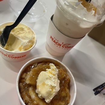 The Peach Cobbler Factory - YUM-o!!! Tastes like home baked goodness in a cup! Will be back again for sure! Pictured is the Peach Shake & Caramel apple cobbler. - Desserts Near Me - Humble, Texas The Peach Cobbler Factory - YUM-o!!! Tastes like home baked goodness in a cup! Will be back again for sure! Pictured is the Peach Shake & Caramel apple cobbler. - Desserts Near Me - Humble, Texas