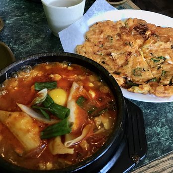 Sunrise House - Left: Soft tofu stew with kimchi, pork and dumplings  Right: Kimchi seafood pancake - Korean Near Me - Toronto, Ontario