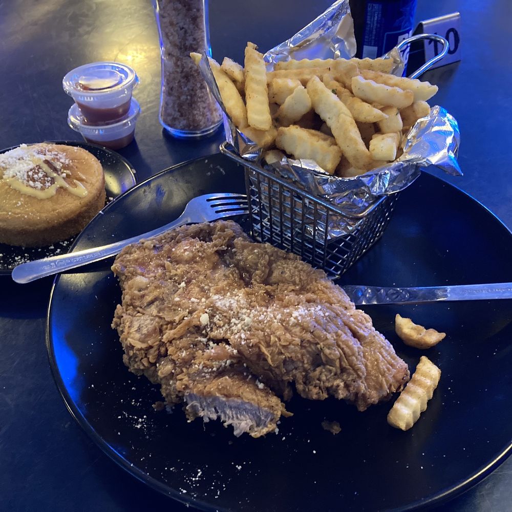 Godfreys - Lunch menu of Fried pork chop, fries and cornbread. - Caribbean Near Me - Flowood, Mississippi